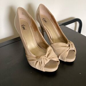 Very loved Fioni peep toes pumps.  Size 8.5W